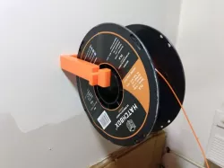 Wall-mounted spool holder