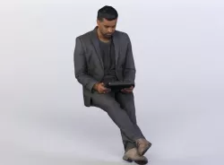 Amir 0439 Man in a Suit sitting, Looking at a Tablet 3D model