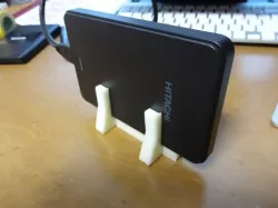 Universal stand for portable HDD, calculator..