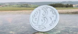 Drink-coaster with letter 'B'