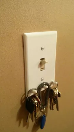 Light switch cover with key hooks