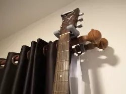 Guitar hanger for curtain rails