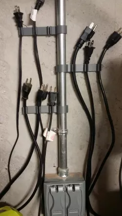 Power cable holder for conduit based wiring