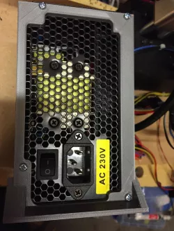 ATX power supply cutout, screw down mounting bracket