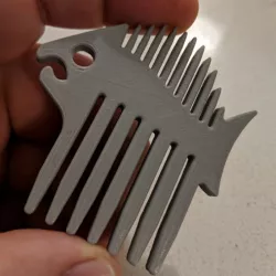 Fish-shaped beard comb