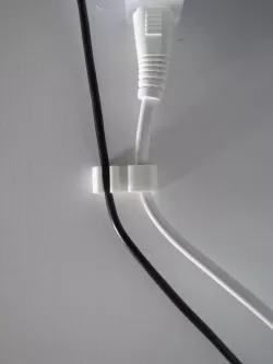 Cable clip (Holder) for USB and AC-Cable. Quick remove for the USB-cable possible.