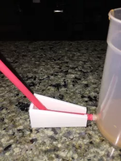Gravity assist cup Straw holder.