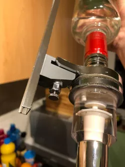 Liquor dispenser rail