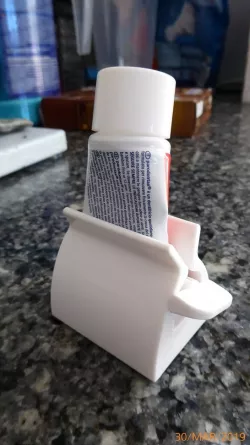 Yet another tooth paste holder and squeezer