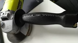 Angle grinder handle with spanner storage