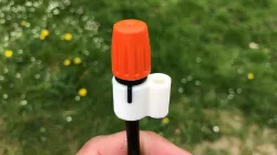 Plant irrigation nozzle holder