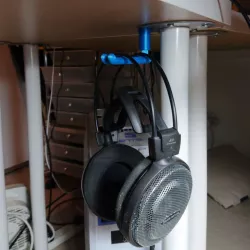 Underdesk headphone hook (snap-fit to a screw-fixed cap)