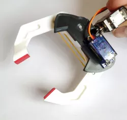 Robotic Gripper / Clamp. Two Degrees of freedom.  Servo controlled
