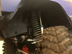 captured spring front suspension/ wheel well