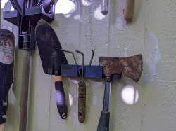 garden tools hangers: shovel, rake, axe, broom, hand tools