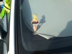 Hand on spring with sign