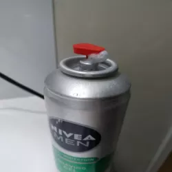 Shaving cream bottle nozzle