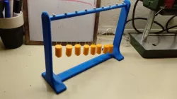 Pendulum Wave: Relating Wavelength to Frequency