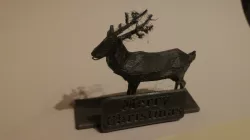 Reindeer with stand and sign