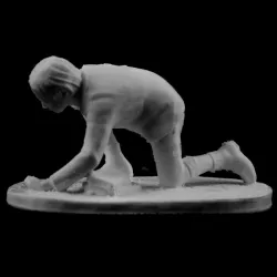 Boy playing with marbles in Valenciennes, France