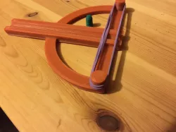 Elastic powered pellet slinger
