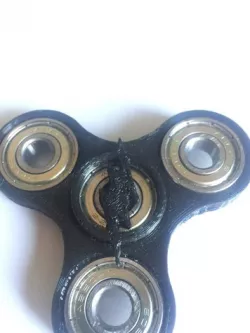Spinner with flash emblem