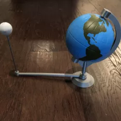Globe model with stand and orbiting Moon