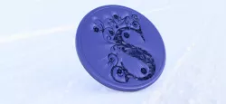 Drink-coaster with the letter 'S'
