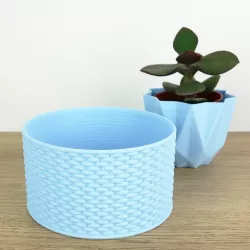 Container with braided pattern