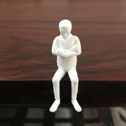 Miniature Human Sitting