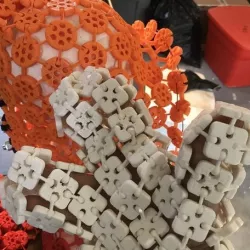 3D printed three fingered glove with snap together square mesh