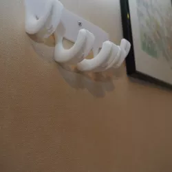 hand to necklace
