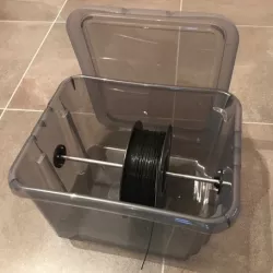 Holder for filament bobbin dispenser with filament bobbin axis and bobbin axis