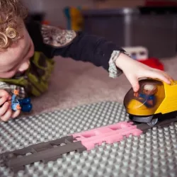 Duplo straight train track rails.