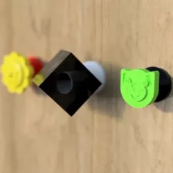 Coat hooks cat, flower and cube.