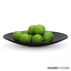 Limes in a black metal bowl