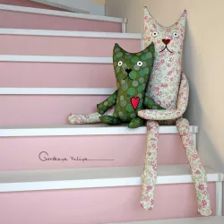 Textile toys cats hanging