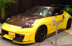 YELLOW NISSAN 2 SEATER SPORTS CAR.