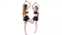Young woman doing yoga routine 54