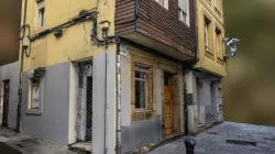 Old town corner house with vending machines scan