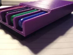 Whiteboard eraser with slots for four fine-point Expo pens