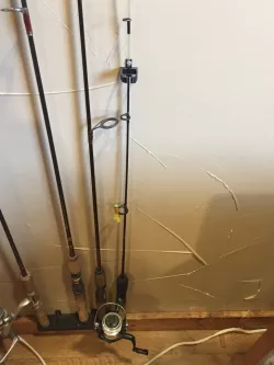 Single fishing pole wall holder 