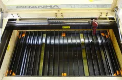 Bed levelling and retaining blocks for Piranha laser cutters