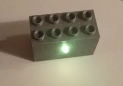 Duplo brick with RGB LED and microcontroller
