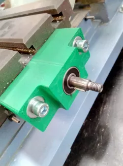Mill feedscrew bearing block