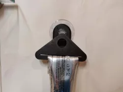 Toothpaste squeezer holder