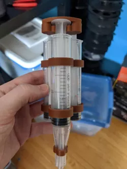 Three syringe combiner