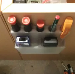 Under-shelf holder for pens, screwdrivers, etc.