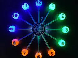 Wall clock with LEDs and kinetic sculpture
