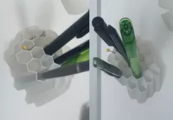Honeycomb wall mounted pen holder